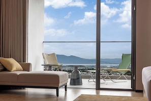 Deluxe Suite, 1 King Bed | Living area | TV