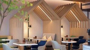 A modern dining area with unique geometric ceiling design, contemporary furniture, and ambient lighting. - Hilton Garden Inn Dali Ancient City (Dali)