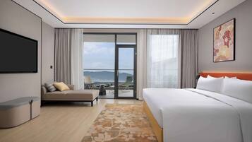 Deluxe Suite, 1 King Bed | Living area | TV
