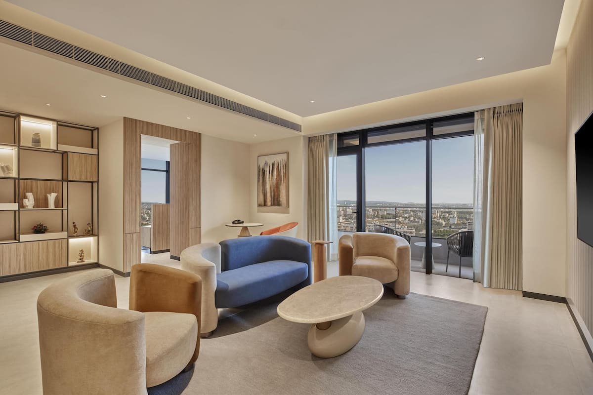 Presidential Suite, 1 King Bed | Living area | 55-inch Smart TV with satellite channels
