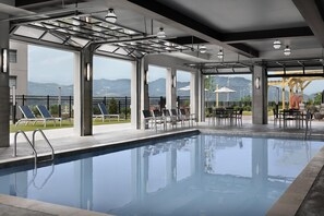 Indoor pool, seasonal outdoor pool, pool umbrellas, pool loungers
