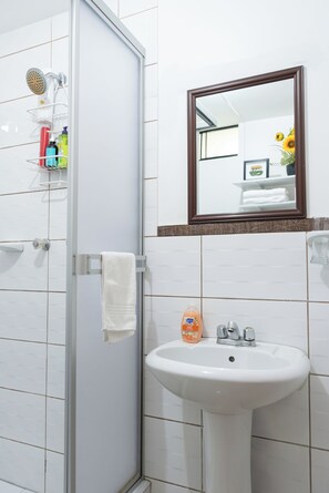 Shower, hair dryer, towels, soap