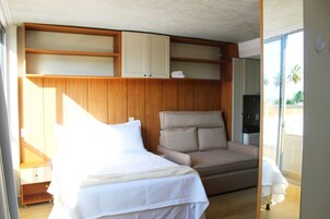 Comfort Studio | Premium bedding, desk, laptop workspace, blackout drapes