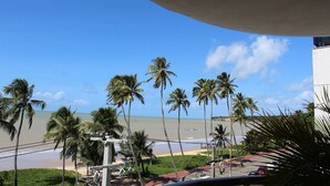 A beach view with palm trees and a clear sky. - Setai Yacht By Day by Day (João Pessoa)
