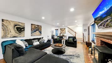 Smart TV, fireplace, foosball, books