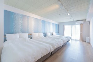 A large, modern hotel room with a long bed, a large window, and a ceiling with recessed lighting. - Naha Shintoshin Hotel (Naha)