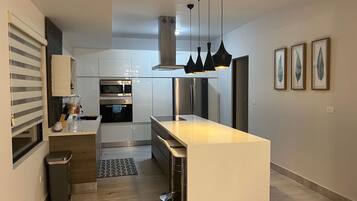 Fridge, microwave, stovetop, coffee/tea maker