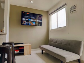 Apartment, 2 Bedrooms, Pool View | Living area | 42-inch flat-screen TV with digital channels