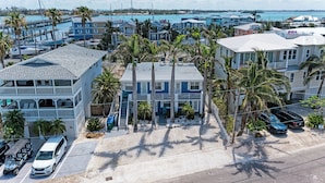 A coastal residential area with multiple two-story houses, a marina, and a pier. - AMI Condo W/ Heated Pool, Walk to Beach & Bridge St (Bradenton Beach)