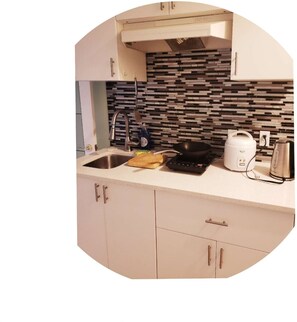 Fridge, microwave, stovetop, coffee/tea maker