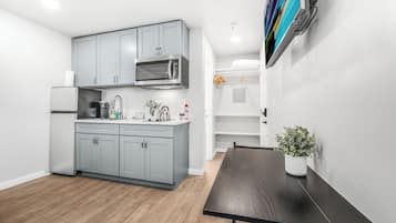 Fridge, microwave, stovetop, coffee/tea maker