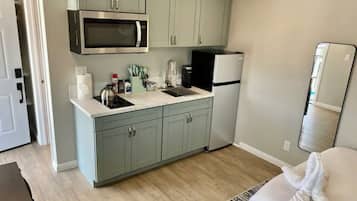 Fridge, microwave, stovetop, coffee/tea maker
