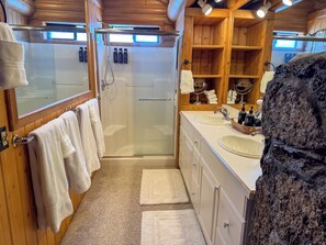 Shower, hair dryer, towels, soap