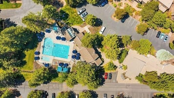 Seasonal outdoor pool, pool umbrellas, pool loungers