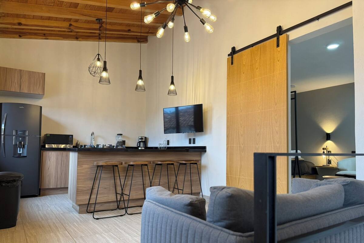 Honeymoon Suite, City View | Living area | 40-inch Smart TV with cable channels, heated floors