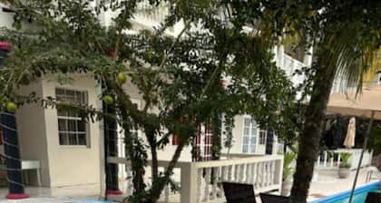 Aparthotel 5-minutes away from beach w/ AC, Wi-Fi, & pool view in RodneyBay