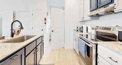 Private townhome with full kitchen, patio and close to everything