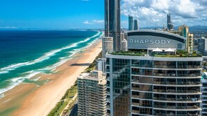 A high-rise hotel with a view of the beach and ocean. - Rhapsody Stunning Ocean Views Apartment - CoastHM (Surfers Paradise)