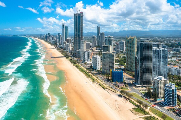A coastal cityscape with a beach and high-rise buildings. - Rhapsody Stunning Ocean Views Apartment (Surfers Paradise)