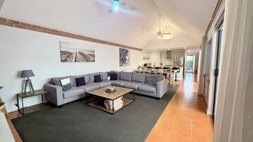 Deluxe House, Multiple Beds, Non Smoking | Living area | 65-inch TV with digital channels