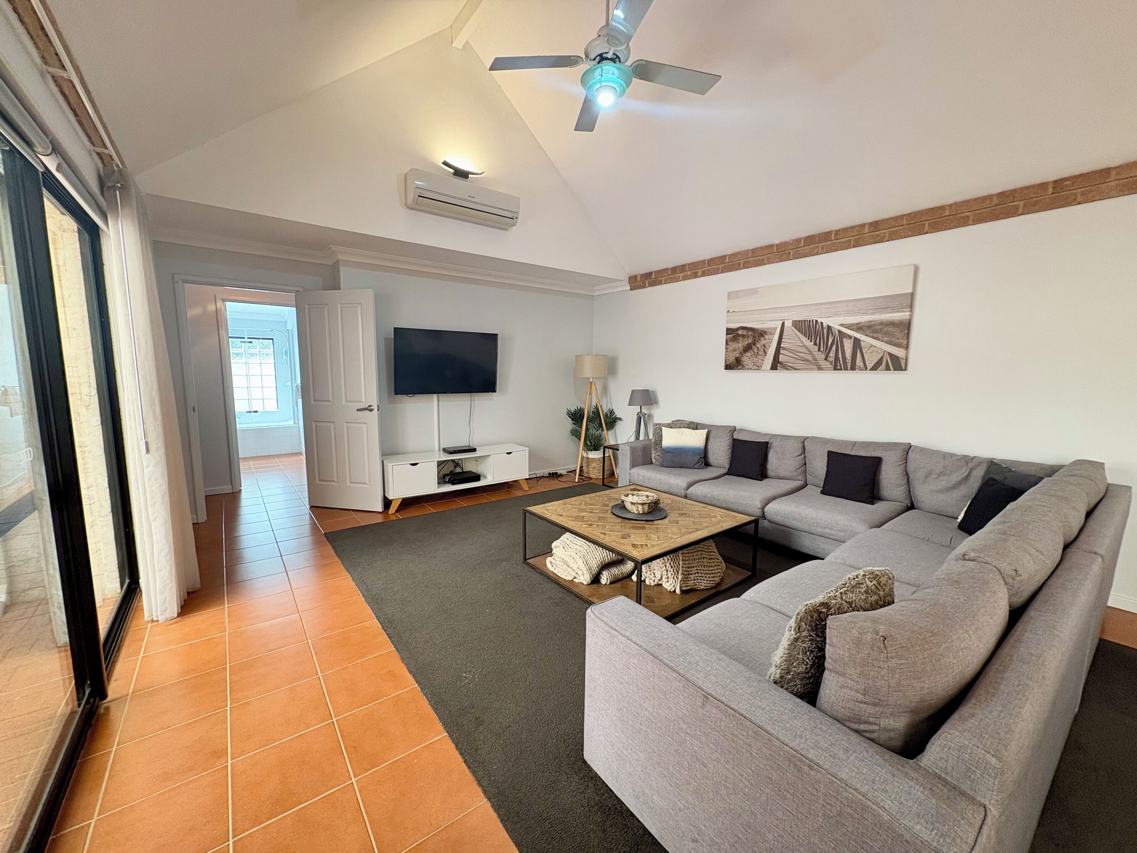 Deluxe House, Multiple Beds, Non Smoking | Living area | 65-inch TV with digital channels