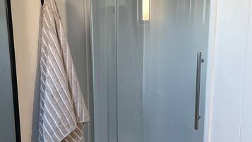 Shower, eco-friendly toiletries, hair dryer, towels