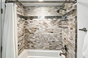 Shower, hair dryer, towels, shampoo