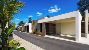 A modern residential street with houses featuring large windows and balconies. - Pool Villa Yagaji Island by Coldio Premium (Nago)