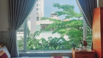 Family Room, Multiple Beds, City View | Soundproofing, free WiFi, bed sheets