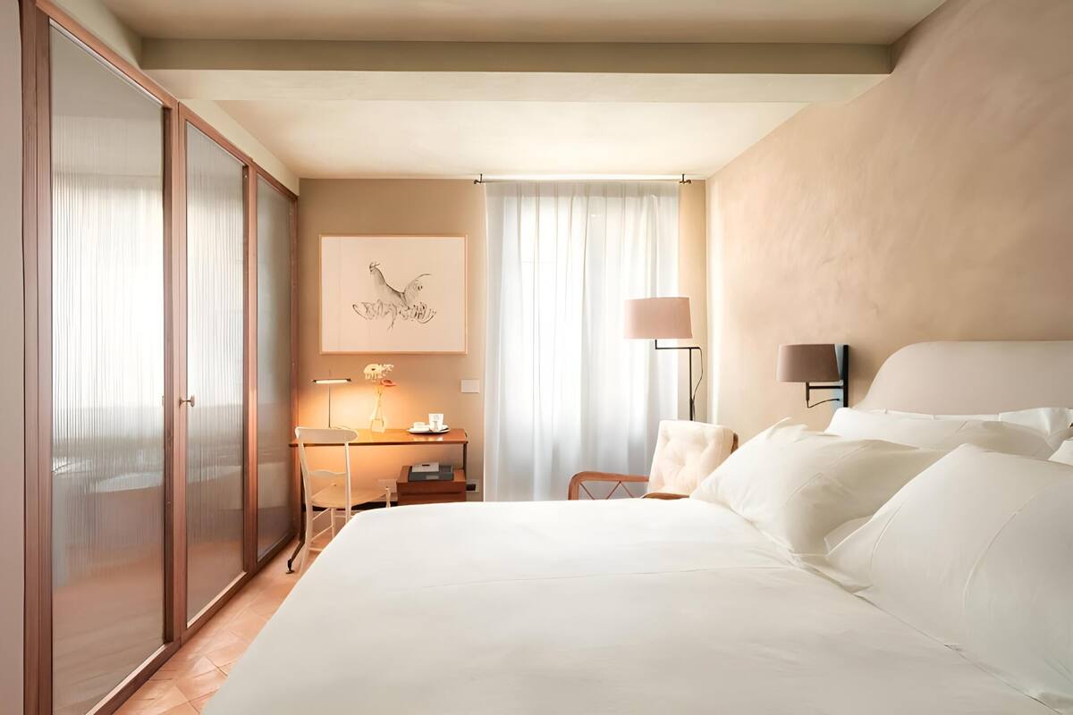 Premium bedding, down duvets, memory-foam beds, desk