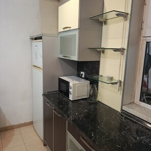 Full-sized fridge, paper towels