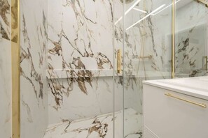 Shower, hair dryer, towels, shampoo
