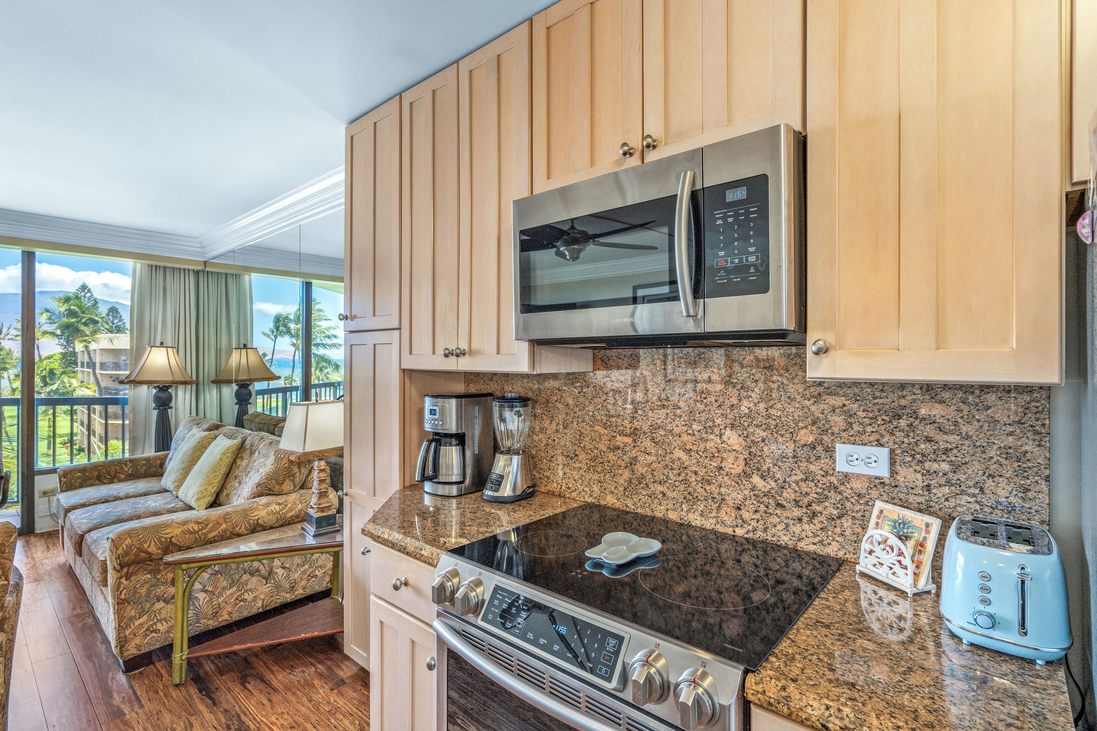 A kitchen with a built-in microwave, toaster, and coffee maker.