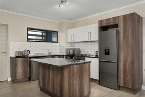 Fridge, microwave, oven, stovetop - 2 Bedroom In the Heart of Century City | Pool (Cape Town)