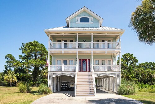 Stunning Marsh Views, 2 Golf Carts Included, 2 Master Suites, expansive decks with ocean breeze