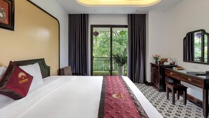 A hotel room with a bed, a desk, a chair, a large window, and a balcony. - Le Maison Tam Coc Boutique Hotel (Nam Hoa Lu)