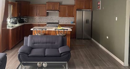 The Home Stay:
Cozy 2-bd 1 ba apt, laundry room, near La Resource Rd., D'Abadie.