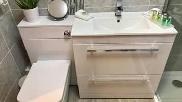Shower, hair dryer, towels, soap