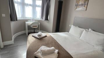 Laptop workspace, blackout drapes, soundproofing, iron/ironing board