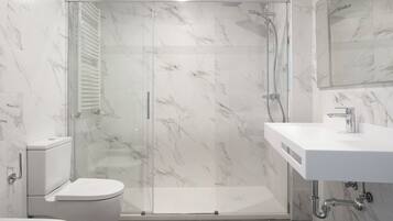 Shower, hair dryer, towels, soap