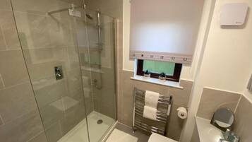 Shower, hair dryer, towels, soap