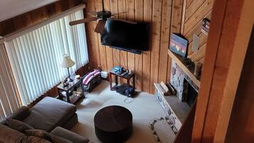 32-inch TV with cable channels, fireplace