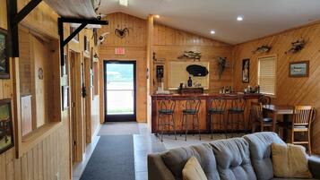 House, Multiple Beds, Patio (The Lodge) | Living area | 32-cm TV with cable channels