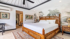 A spacious bedroom with a large bed, a ceiling fan, and a tropical mural on the wall. - 3-Bedroom Kejora 12 (Denpasar)