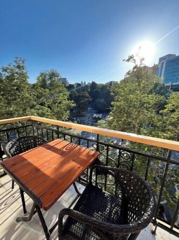 Outdoor dining - Modern 2BR Cozy Haven on Nizami St with a Balcony (Baku)