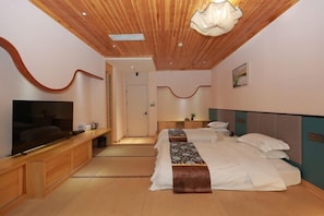 A modern bedroom with a wooden ceiling, a flat-screen TV, a bed with a patterned bedspread, and a bedside table. - Shanghai Duyuan Boutique Hotel (Minhang Shuangbai Road Subway Station Branch) (Shanghai)