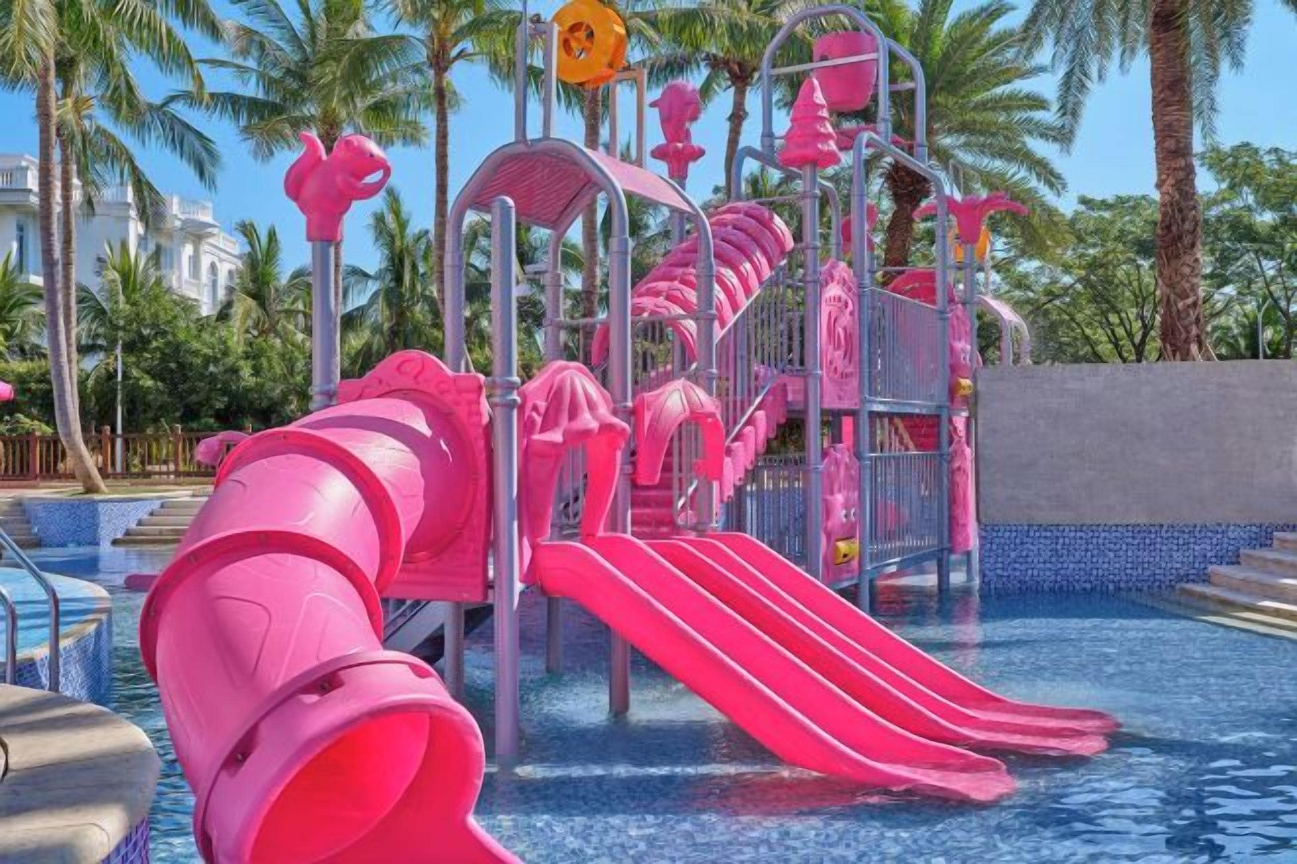 A water park with multiple slides and a pool area.