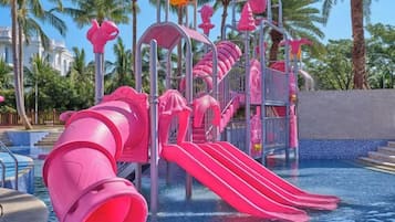 A water park with multiple slides and a pool area.