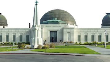 A large observatory with three domes, a central tower, and a symmetrical facade.