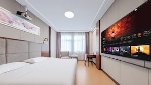 A hotel room with a large bed, a desk with a chair, a flat-screen TV mounted on the wall, and a window with curtains. - Runxi Yueju Hotel (Zhengzhou Erqi Wanda Plaza) (Zhengzhou)